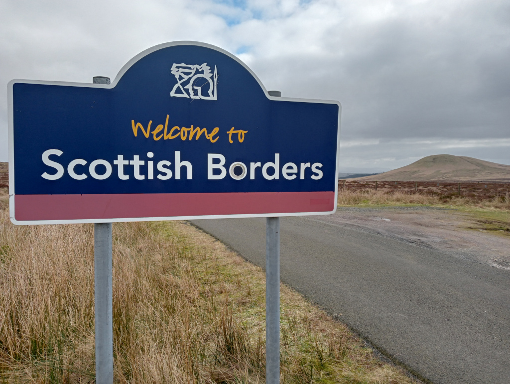 Roadsign displays Welcome to the Scottish Broders.
