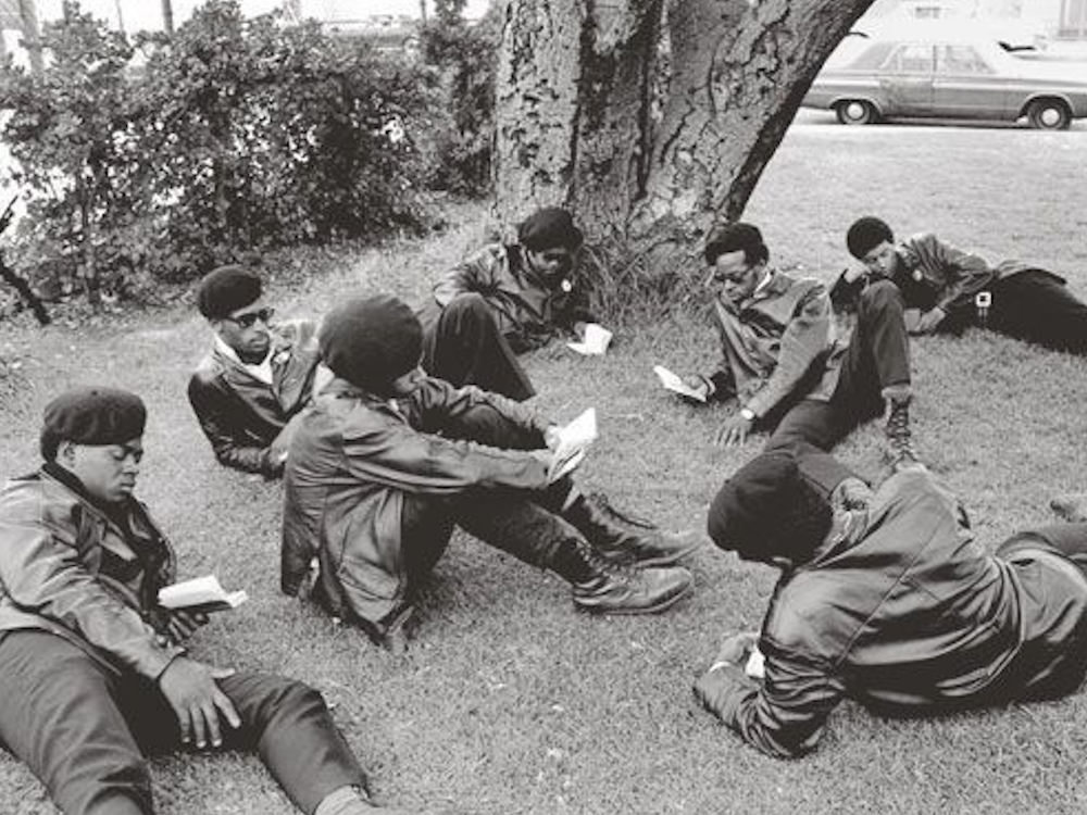 Black Panthers studying quotes from Maos Little Red Book