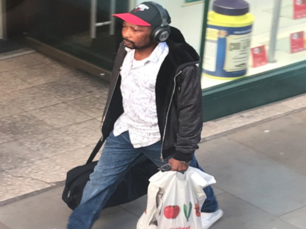 praxis stalker with love tescos shopping and black bag, sporting a <strong>Chicago</strong> bulls baseball cap