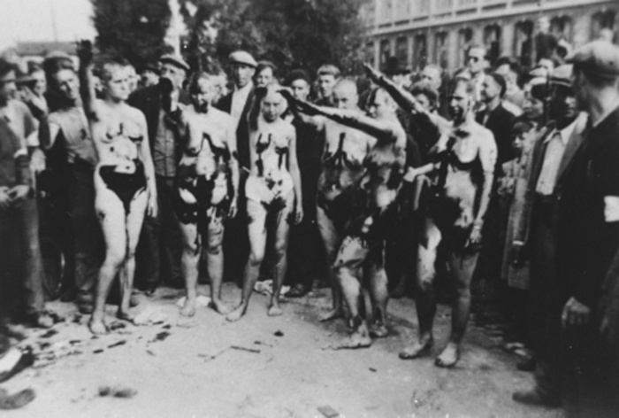 Naked French women smeared with tar/oil are forced to salute.