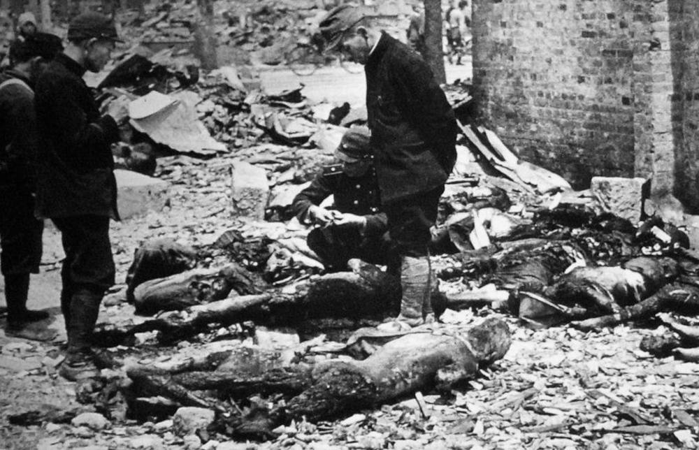 Japanese policemen seen identifying victims of Allied fire bombing