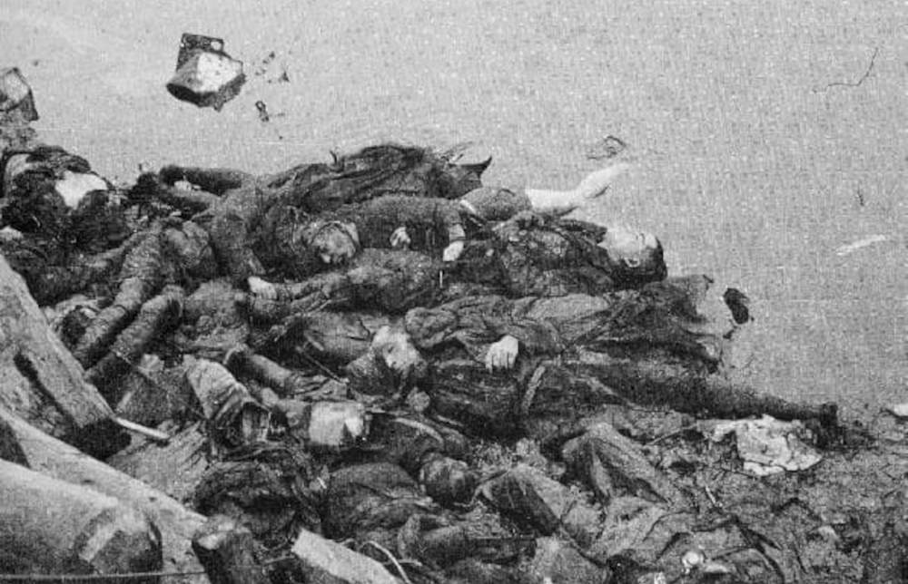 Dead bodies of Japense victims half submered into a river